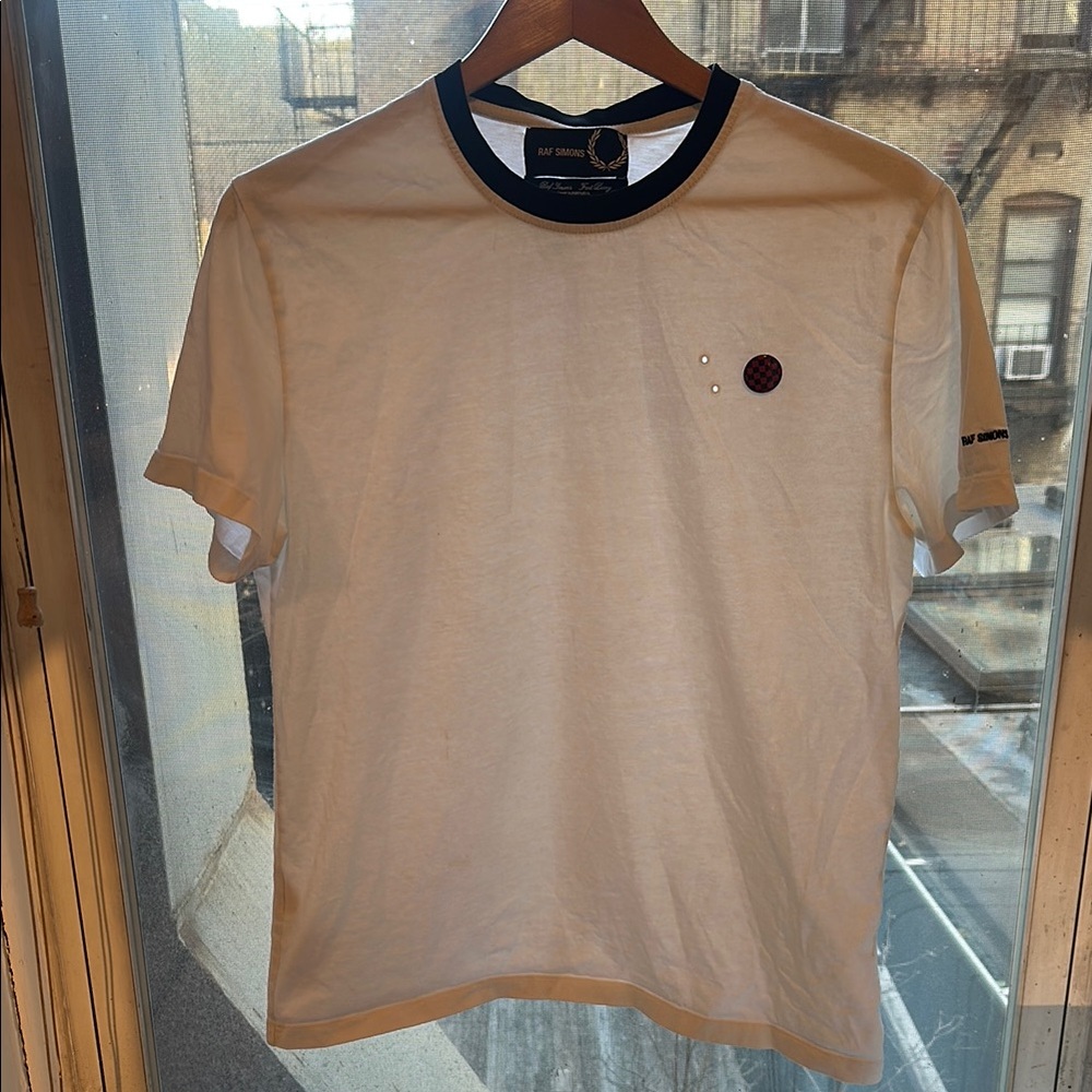 Raf Simons White T-Shirt with Black Trim.